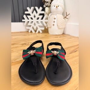 Stylish Black Sandals with Green and Red Bow